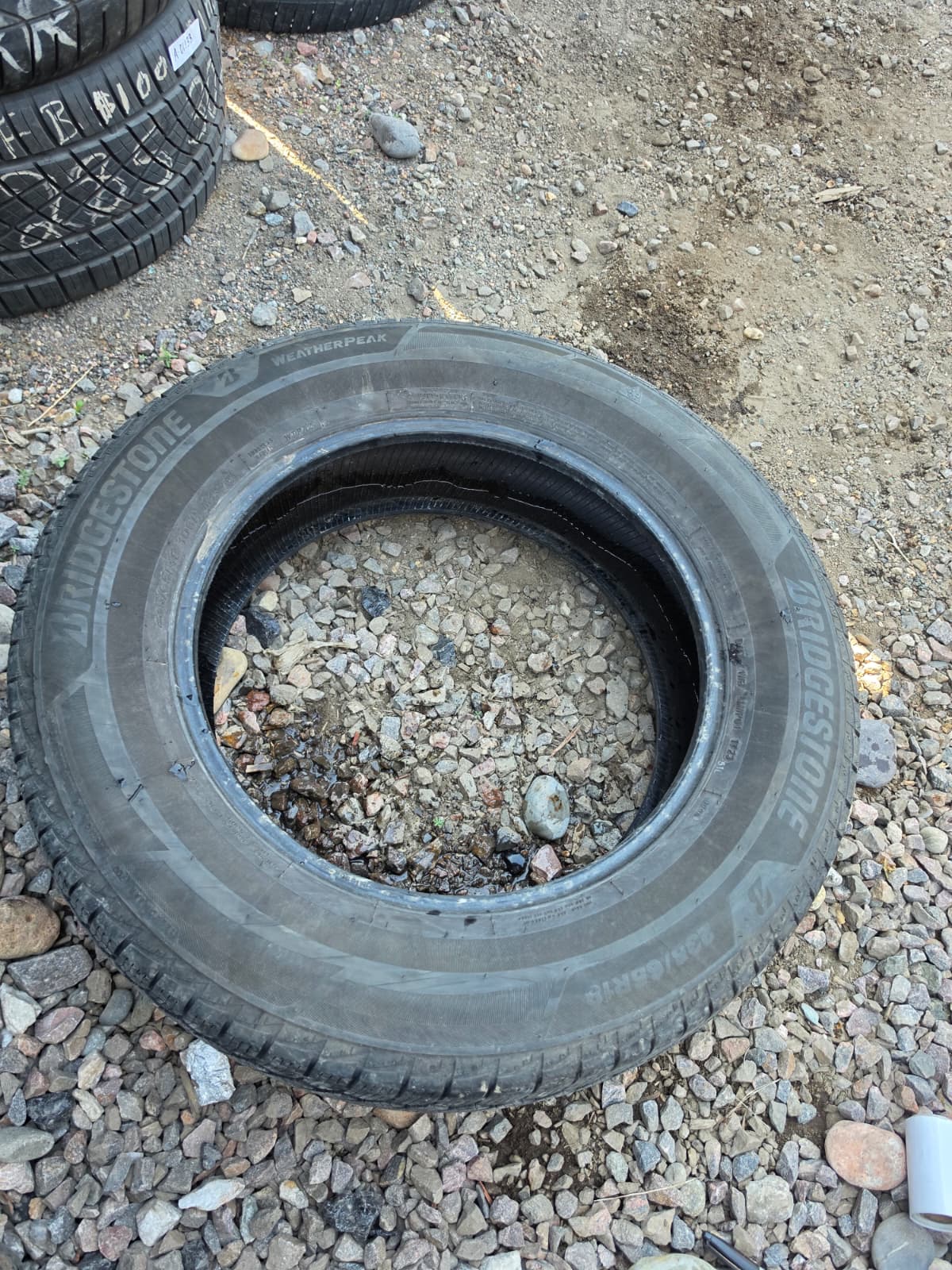 235/65R18 Single (1 Used Tire) Bridgestone Weather Peak
